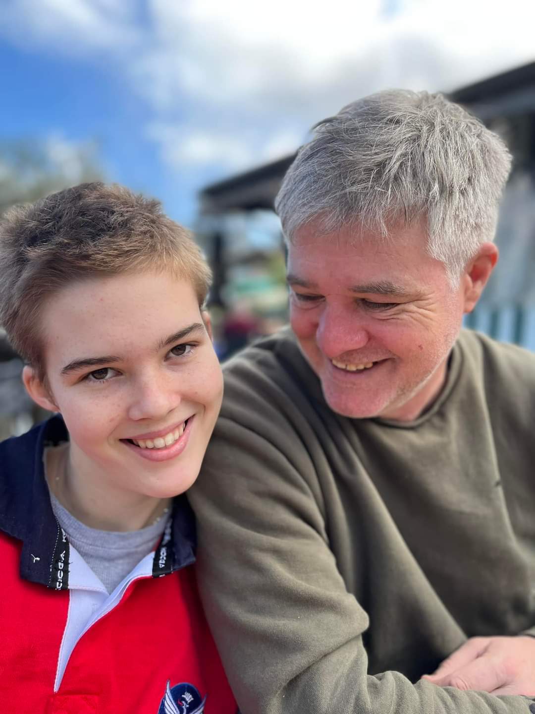 Colour photograph of Taylor Doyle with her father Karl. They are both smiling.