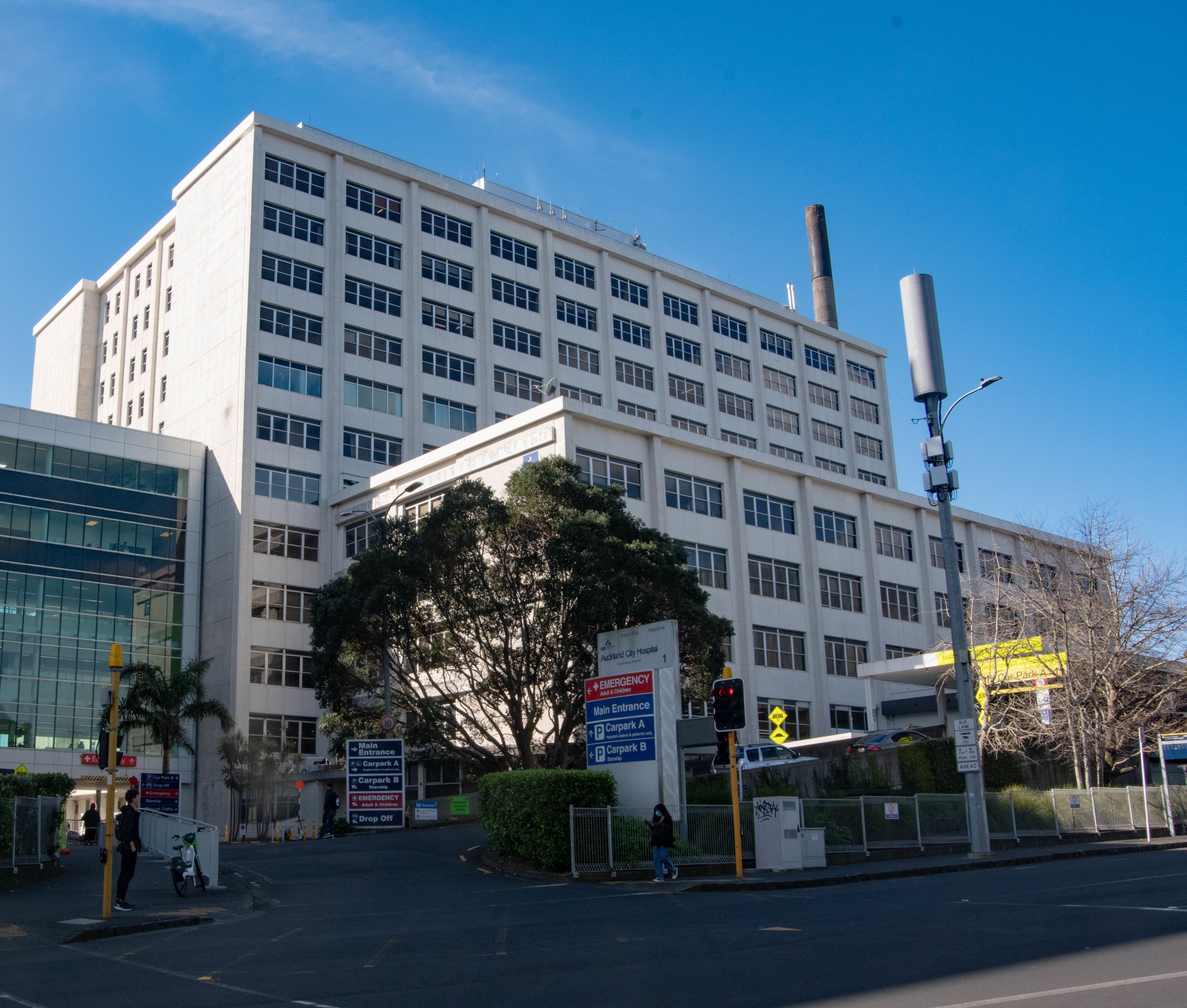 Colour photograph of Auckland Hospital's main building taken from street level.
